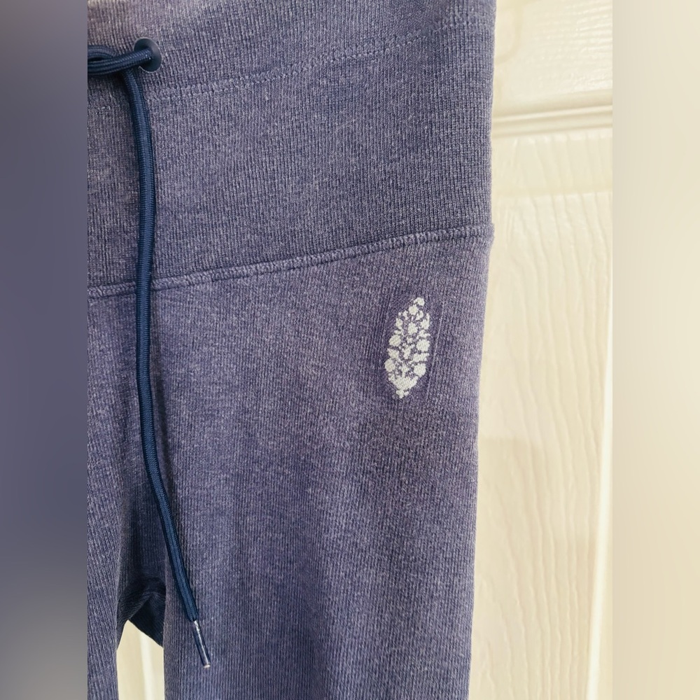 Three people tie wasted leggings